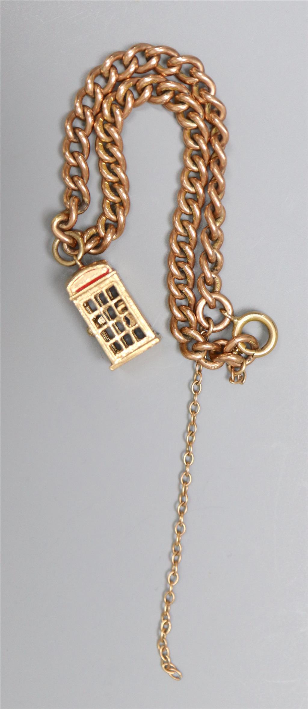 A 9ct gold curb link bracelet, hung with a 9ct gold telephone box charm, gross 12.1 grams.